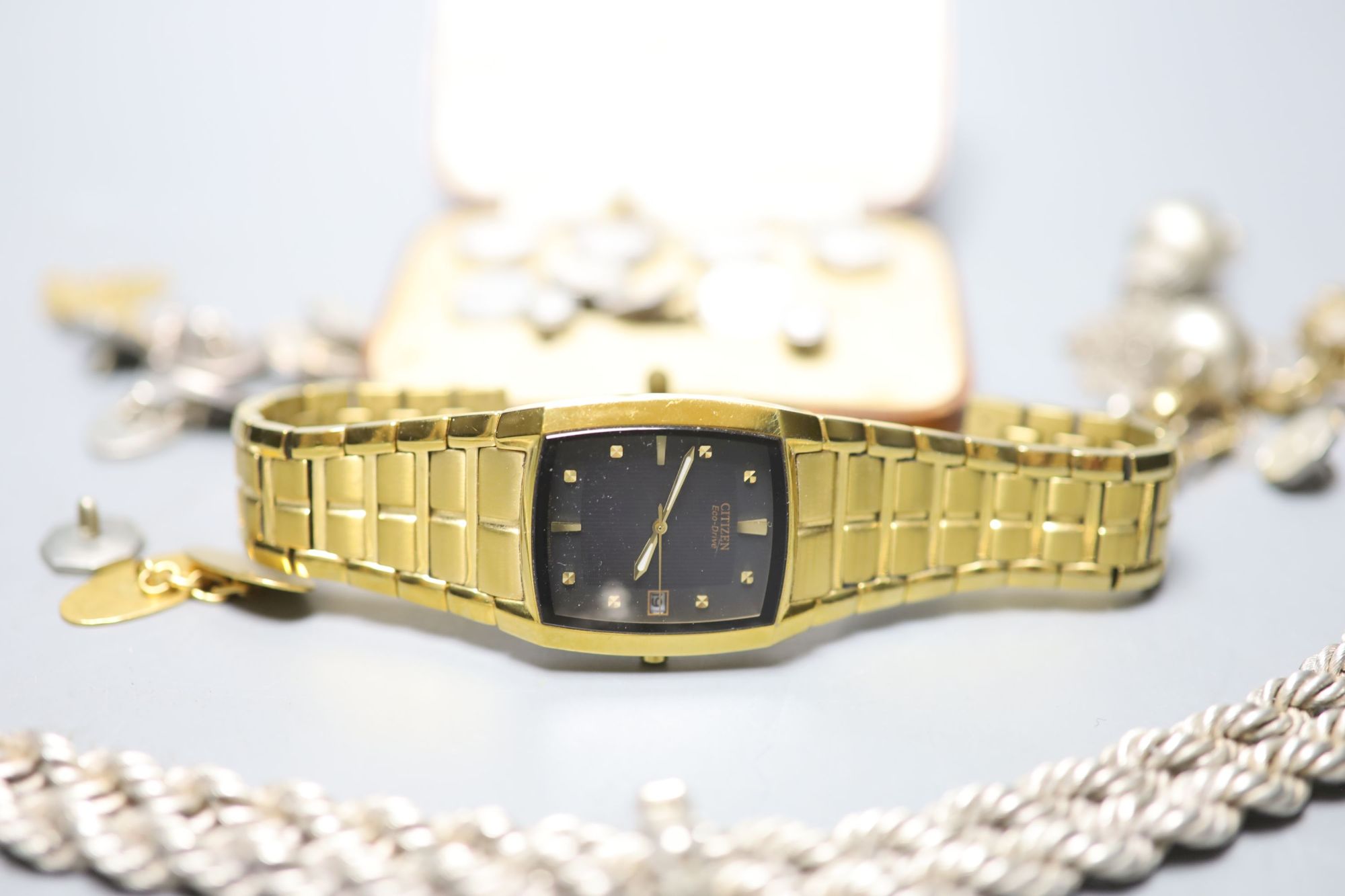 A ladys 9ct gold wrist watch on a plated strap, a Citizen Eco Drive watch, a cased six piece white metal and mother of pearl...